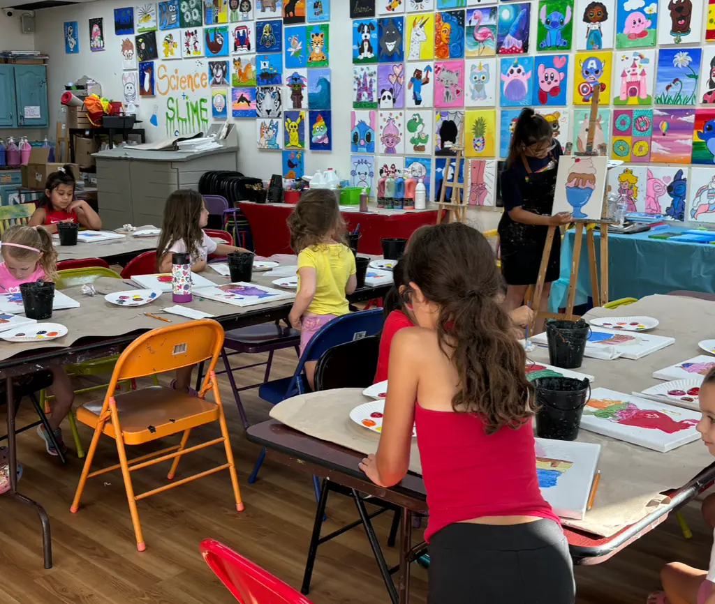 A kids mixed media class at work in the bright studio